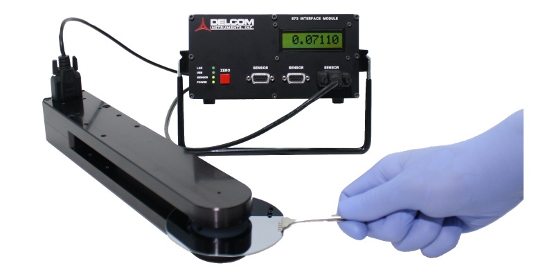 Non-contact eddy current instrument for measuring the sheet conductance or Ohms/sq of thin films or other thin, conductive materials.